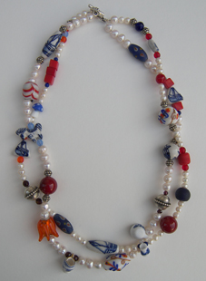 Sieraad dubbel Caroline van Rhijn